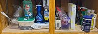 Full cabinet view showing grouped cleaning products and accessories