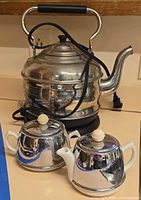 Cuisinart kettle with cord, Heatmaster creamer and sugar in front