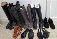 Group shot showing all nine pairs of boots and sandals