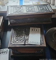 Two stacked wood boxes showing hammered metal tops and wood sides