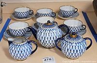 Full view showing teapot, sugar bowl, creamer, six cups and six saucers
