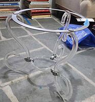 Full view of side table frame showing lucite legs and metal top ring