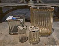 All four bathroom accessories grouped together