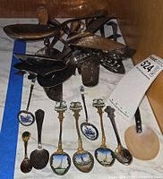 Full lot overview showing serving utensils and souvenir spoons