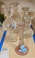 Group shot showing bud vase and four crystal candlesticks