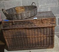 Large wicker chest trunk with lid and two other baskets on top