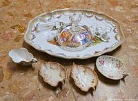 Group shot showing all porcelain and glass items on floor