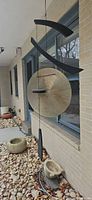 gong style wind chime hanging outside house