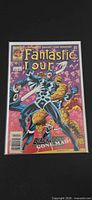 Front cover of Fantastic Four #411 in bag and board