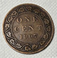 Reverse view showing denomination, date and maple leaf wreath