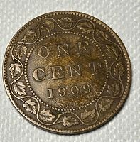 Reverse side: ‘ONE CENT 1909’ within decorative maple leaf border