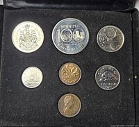 Open presentation case showing all six coins in foam insert