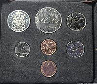 Open presentation case showing all seven 1978 coins and medallion in flocked insert