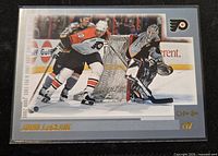 Front of 2000-01 O-Pee-Chee John LeClair card in sleeve