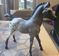 Left-front view of gray Appaloosa Breyer foal figurine
