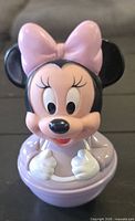 Front view of Minnie Mouse roly-poly figure showing overall design and colors