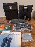 Binoculars, case, accessories laid out