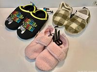 All three pairs of slippers displayed together