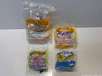 All four sealed figurine bags