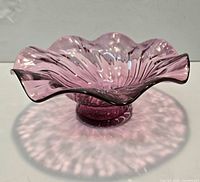 Overall view of pink ruffled glass compote bowl