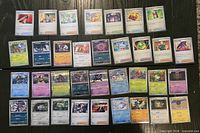 All 34 sleeved Japanese Pokémon cards laid out in five rows.