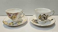Both teacup and saucer sets side by side showing patterns