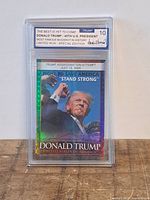 Front of graded Donald Trump limited run trading card showing image, holographic border and grade 10 label