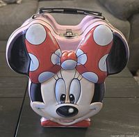 Front view of Minnie Mouse shaped lunch box showing latch and handle