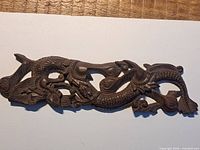 Full view of carved wooden dragon plaque