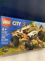 Front of sealed LEGO City 60387 box showing vehicle and piece count