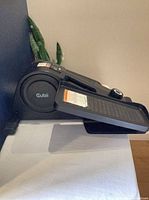Full side view of Cubii mini elliptical showing pedals and compact profile