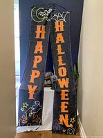 Full view of two-piece "Happy Halloween" banner