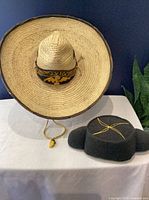 Sombrero and montera side by side on table