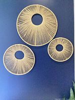 Front view of all three jute rope wall panels against wall
