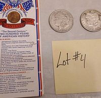 Bicentennial timeline card with 1976 cent and two Morgan dollar replicas