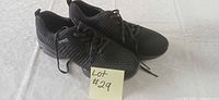 Top view of pair of black mesh Sechrite sneakers with laces