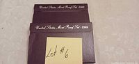 Outer sleeves for 1988 and 1989 U.S. Mint Proof Sets stacked