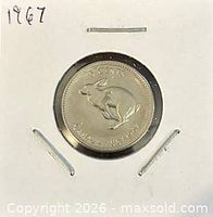 Front of 1867-1967 Canadian 5-cent coin showing rabbit reverse in holder