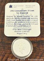 Information card detailing composition, designer, weight, diameter