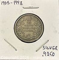 Coin in 2x2 flip showing reverse crowned wreath design 25 CENTS CANADA 1908-1998