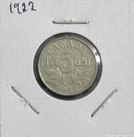 Reverse of 1922 Canada 5 cents coin in flip