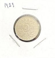 Full view of 1923 Canadian 5-cent coin in holder