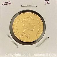 Obverse of 2002 proof Canadian one-dollar coin in holder