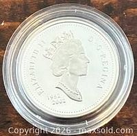 Obverse of coin showing Queen Elizabeth II portrait and years 1952-2002