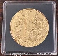 Reverse side of coin showing royal coach design and CANADA DOLLAR text in capsule