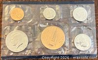 Front view of all six sealed coins in plastic
