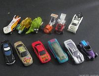 All 12 Hot Wheels vehicles arranged in two rows