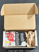 Open cardboard box showing stacked 1994-95 Donruss hockey cards