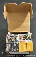 Open box showing back of hockey cards inside