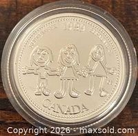 Reverse of 1999 Canada 25-cent Millennium Celebration coin in capsule